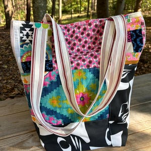 Lined Improv Patchwork Tote with striped canvas handles. One-of-a-kind tote bag handmade from vintage and thrifted fabrics.