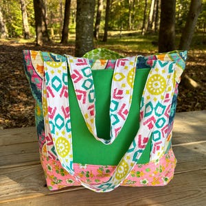 Patchwork Canvas Market Tote with two lined exterior pockets. One-of-a-kind tote bag handmade from vintage and thrifted fabrics.