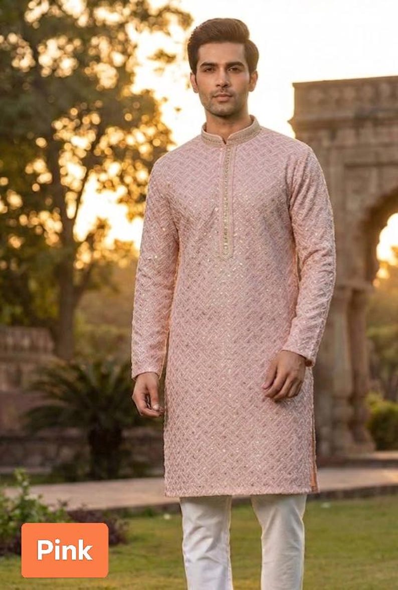 May include: A light pink long-sleeved kurta with a geometric pattern and a mandarin collar. The kurta is paired with white pants. The word "Pink" is in a box in the lower left corner.