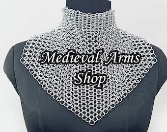 May include: A silver chainmail collar necklace, also known as a gorget, on a black mannequin. The chainmail is made of small, interlocking metal rings. The text "Medieval Arms Shop" is printed on the chainmail.