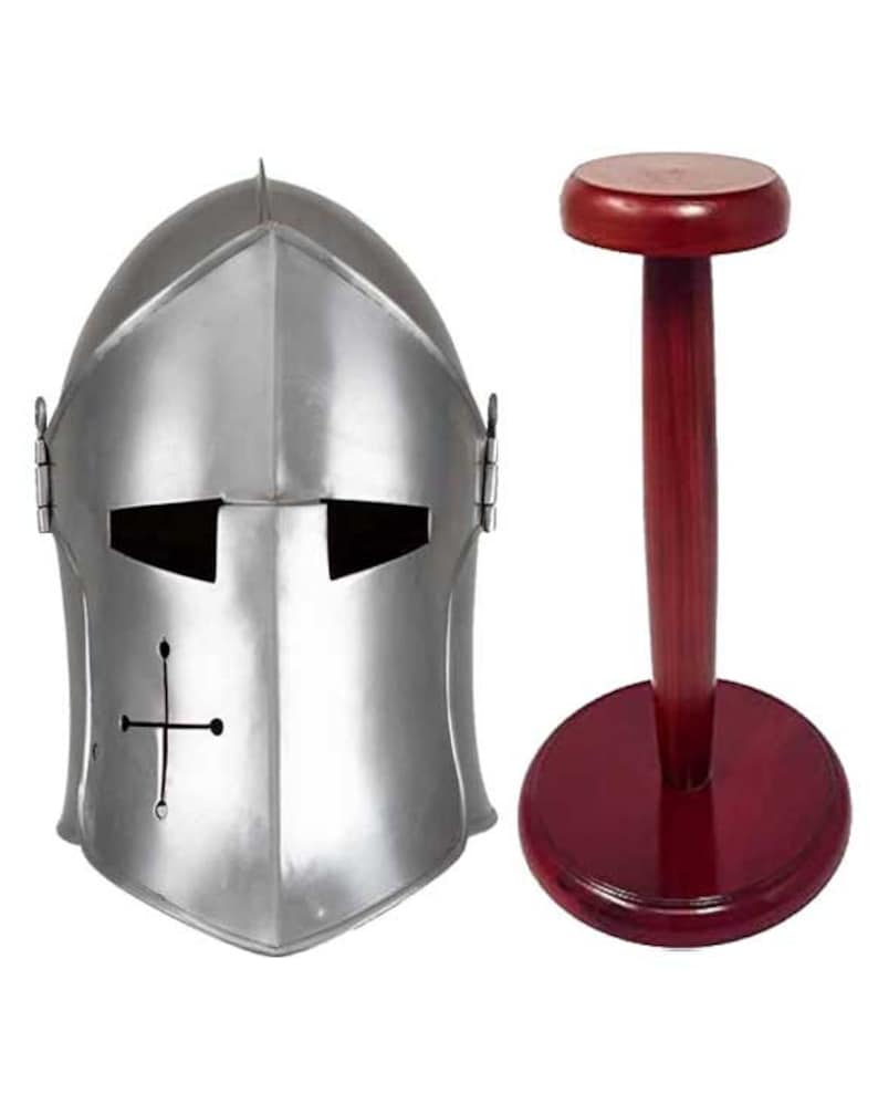 May include: A silver helmet with a cross on the front, displayed on a wooden stand with a red finish.