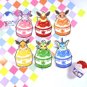 May include: Six die-cut stickers featuring various Pokémon characters sitting atop colorful shaved ice desserts in paper cups. Each cup displays a Japanese kanji character. Two small 3D shaved ice miniatures are also present.