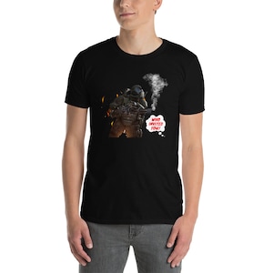 May include: A black t-shirt featuring a graphic of a soldier in a helmet holding a gun and a speech bubble that says "Who invited you!"