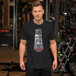 May include: A black t-shirt with a graphic of a Dalek from Doctor Who. The Dalek is blue and silver and has a cat inside. The text on the shirt reads "We all knew it really!"