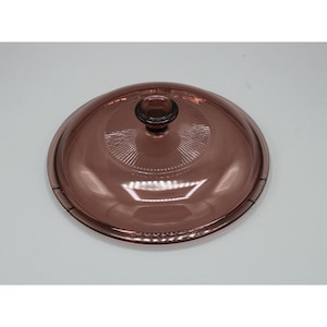 May include: A set of three ceramic mugs with a speckled, matte finish. The mugs are in shades of cream, light gray, and dark gray. Each mug has a simple, minimalist design and a rounded handle.