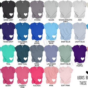 May include: A selection of short-sleeved t-shirts in a range of colours, such as black, navy, and pink. Each shirt features a white heart design. The image also includes text suggesting the best colour combinations.