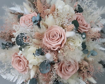 Bridal bouquet of dried flowers in pastel shades with stabilized roses