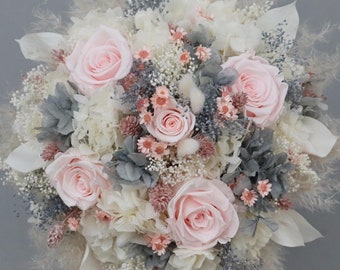 Bridal bouquet of dried flowers in pastel shades with stabilized roses