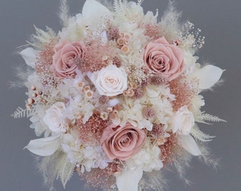 Bridal bouquet of dried flowers in pastel tones with stabilized roses