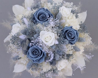 Fantastic bridal bouquet of dried flowers in blue, cream and white with stabilized roses