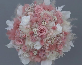 Dreamlike bridal bouquet of dried flowers in shades of rose, cream and white with stabilized roses