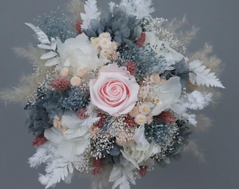 Delicate bridal bouquet/ civil ceremony bouquet made of dried flowers in pastel shades with a preserved rose