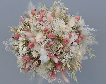 Meadow flower bridal bouquet made of dried flowers in pastel tones