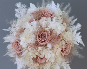 Dreamlike bridal bouquet of dried flowers in pastel shades with stabilized roses