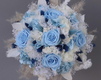 Bridal bouquet of dried flowers in blue, cream and white with stabilized roses