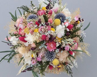 Colorful meadow flower bridal bouquet made of dried flowers