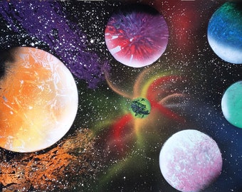 May include: A spray paint art piece depicting a galaxy with multiple planets in various colors, including orange, red, green, blue, and pink. The planets are surrounded by a black background with white stars.