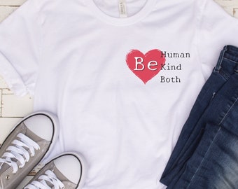 May include: White t-shirt with a red heart and the text "Be Human Kind Both" printed on the front.