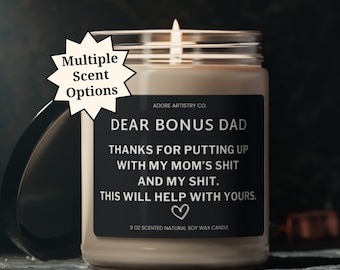 May include: A brown soy wax candle with a black label that reads "Dear Bonus Dad Thanks for putting up with my mom's shit and my shit. This will help with yours." The candle is 9 oz and is scented.