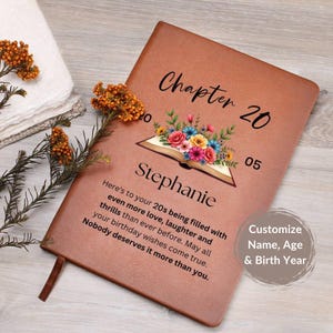 May include: A brown leather journal with the text "Chapter 20" and "Stephanie" printed on the cover. The journal features a floral design and a quote about birthdays. The text "Customize Name, Age & Birth Year" is also visible.