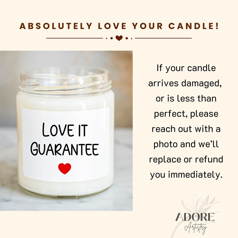 a white candle with a red heart on it