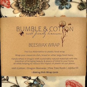 May include: Beeswax wrap with floral patterns in cream, red, and blue. The wrap is labeled "Bumble & Cotton" and is described as an eco-friendly alternative to plastic wrap. It measures 13x20 inches.