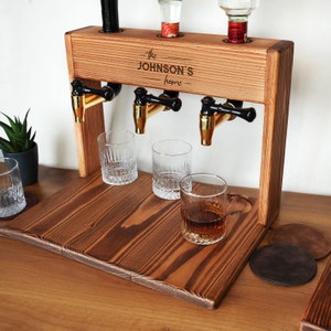 a wooden stand with three glasses on it