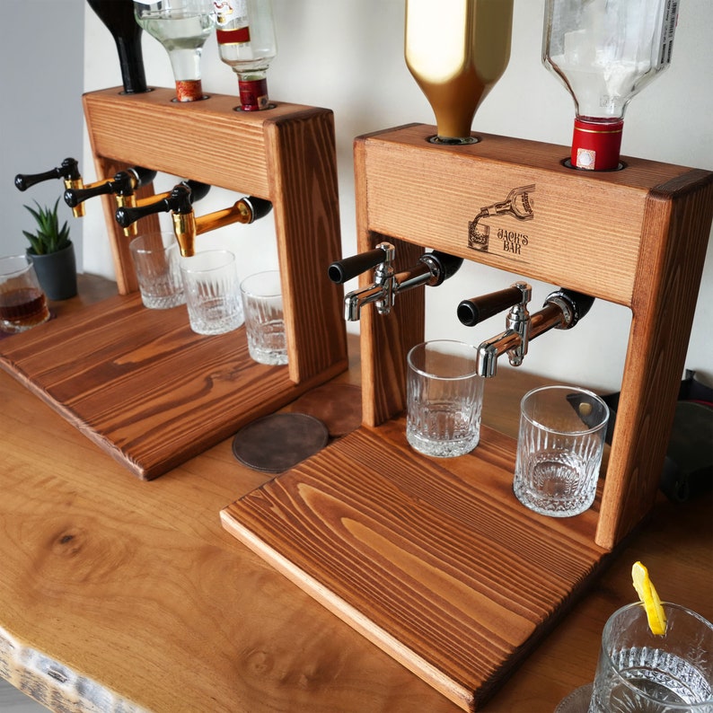 a couple of glasses sitting on top of a wooden table