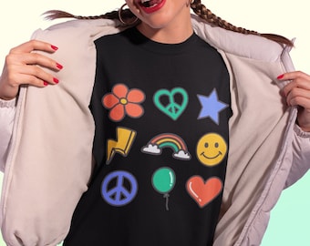 May include: Black t-shirt with a colorful graphic print of various symbols, including a flower, heart, star, lightning bolt, rainbow, smiley face, peace sign, balloon, and heart.