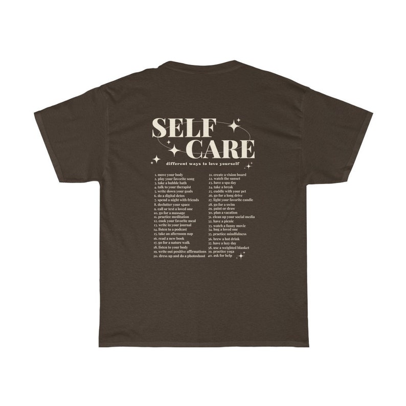 May include: A brown t-shirt with the text "SELF CARE" in white with stars around it. The text "different ways to love yourself" is below the main text. A list of self-care tips is printed below the text.