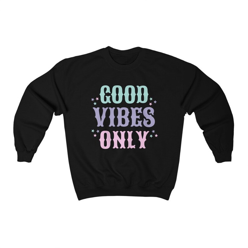 May include: Black sweatshirt with the text "GOOD VIBES ONLY" in pastel colors with stars around the words.