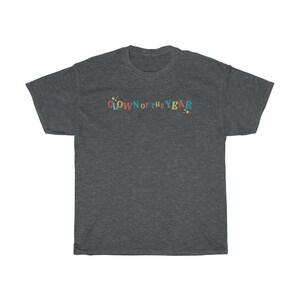 May include: A dark heather grey t-shirt with the text "Clown of the Year" in colorful letters.