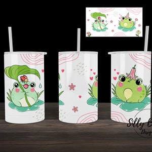 Dois sapos fofos em almofadas de lírio animal verde e rosa sublimação reta copo com canudinho design 12 onças. Download digital do modelo de envoltório completo