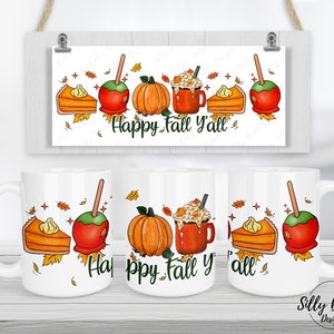 May include: White ceramic mug with a fall-themed design. The mug features a slice of pumpkin pie, a caramel apple, a pumpkin, a cup of hot cocoa, and the text "Happy Fall Y'all".