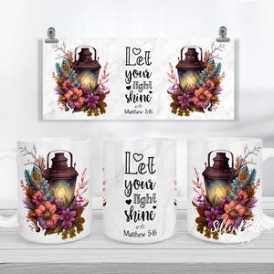 May include: White ceramic mug with a floral design and a lantern. The mug has the text "Let your light shine" and "Matthew 5:16" printed on it.