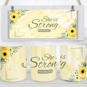May include: Two white ceramic mugs with a yellow background and green floral design. One mug has the text "She is Strong" and "Proverbs 31:25". The other mug has a floral design with sunflowers and green leaves.