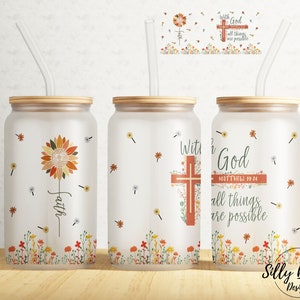 May include: Three frosted glass tumblers with lids and straws. The tumblers feature a floral design with sunflowers, dandelions, and cross designs. The text on the tumblers reads "With God all things are possible" and "Faith".