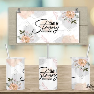 May include: A set of three white tumblers with a floral design and the text "She Is Strong Proverbs 31:25".