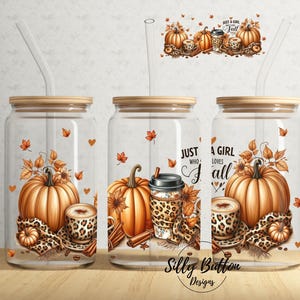 May include: Three glass jars with lids and straws, decorated with fall-themed designs. The jars feature pumpkins, leaves, and the text "Just a girl who loves fall".
