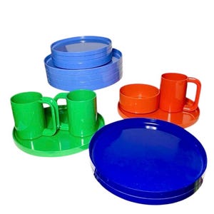 Heller Melamine Stackable Plate Sets Green Orange, Periwinkle Blue, Blue.