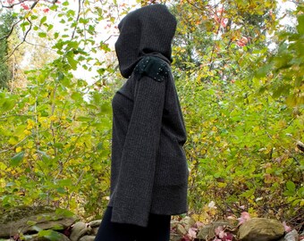 Hooded cloak shirt, with asymmetrical leather shoulder patches and metal detailings, from the Kreatur collection