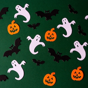 May include: A green background with black bats, white ghosts, and orange pumpkins with jack-o'-lantern faces.