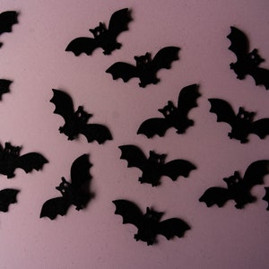 15 Wool blended black felt bats for stitching or gluing to your Halloween projects.  They are cut from 40 % wool blended felt