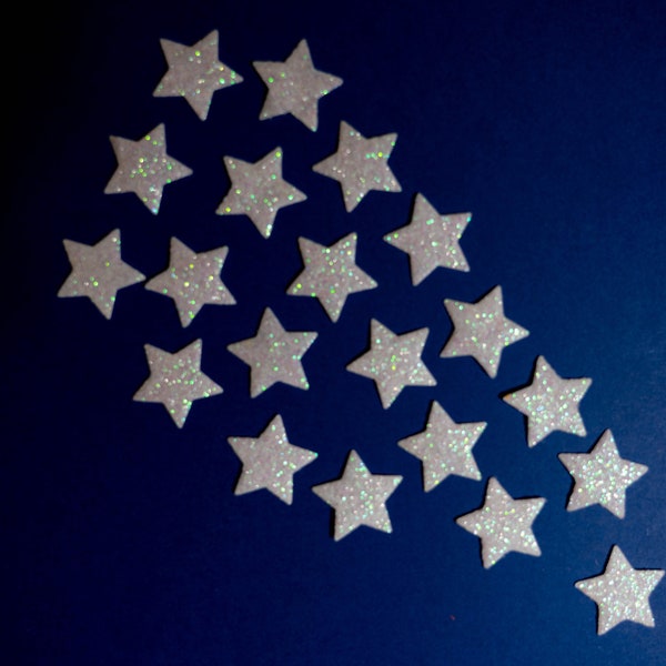 20 white glitter felt stars for stitching or gluing.  20 white felt die cuts.  Glitter one side only