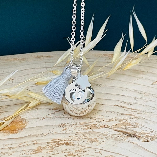 Silver pregnancy bola with small star and pompom feet charm