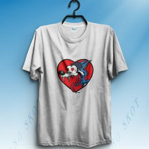 May include: A grey t-shirt featuring a cartoon wolf with red eyes and a tongue sticking out, inside a red heart.
