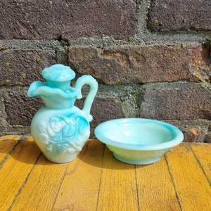 Seventies green with blue swirl milk glass bath oil jug (6 fl oz) and rose embossed bowl by Avon