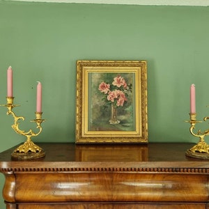 Pendant French Rococo candlesticks, two-armed on marble base, baroque gilded appearance, eye-catchers in the home 17 x 27 cm.