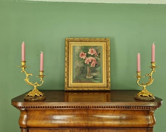 Pendant French Rococo candlesticks, two-armed on marble base, baroque gilded appearance, eye-catchers in the home 17 x 27 cm.