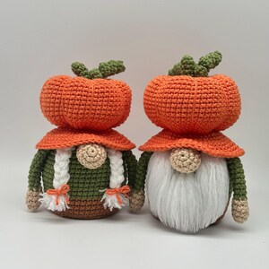 Two crocheted gnomes with orange pumpkin-shaped hats, one with white braided hair and the other with a white beard. Digital PDF download.